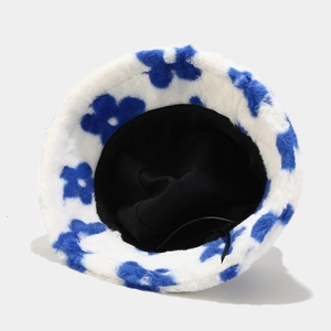 Winter plush bucket hat in white faux fur with blue flower patterns and adjustable drawstring
