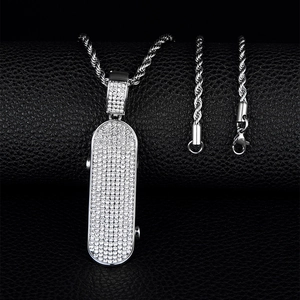 Silver iced out scooter pendant with twist chain, hip hop jewelry on leather texture