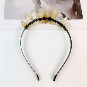 Macro detail of handmade black wire wrapping on natural raw crystals for crown headband