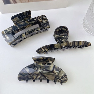 Three-piece black and gray marble acetate hair claw set with rectangular and round designs