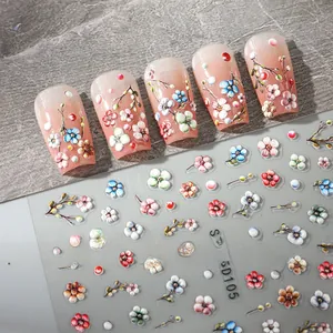 Detailed 5D embossed nail art stickers featuring colorful plum blossoms and floral patterns