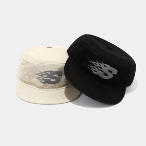 Flat top cotton duckbill hats in beige and black with gray flame S letter graphic