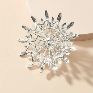 Detailed back view of silver double-layered flower brooch with pin clasp and alloy texture