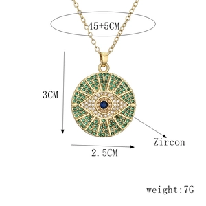 Detail of round eye pendant with green and clear zircons showing size and weight specs