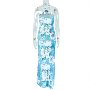 Detailed view of backless halter neckline and vibrant blue floral print maxi dress