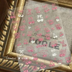 Detail of pink glitter cherry and bow nail art stickers with ta-385 model number