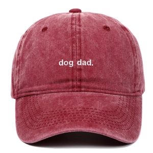 Washed cotton baseball cap in wine red featuring dog dad embroidery on the front