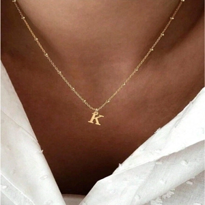 Minimalist gold stainless steel letter K pendant necklace for women on neck