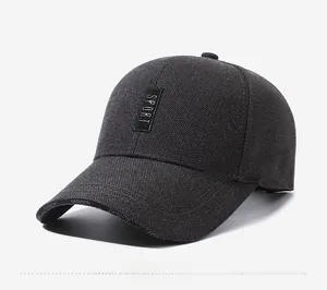 Close-up of a dark grey baseball cap with SPORT label and FASHION text detail