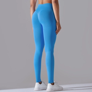 Detail of cross-waist design and V-shaped seam on blue seamless yoga pants