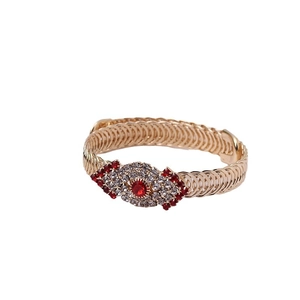 Golden Evil Eye bangle with red and white crystals in a vintage geometric design