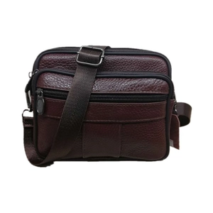 Detailed close-up of dark brown genuine leather messenger bag with multiple zip pockets