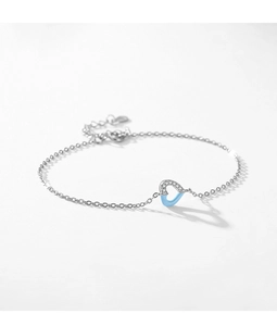 Detail of S925 silver heart bracelet featuring micro-pave crystals and blue enamel inlay