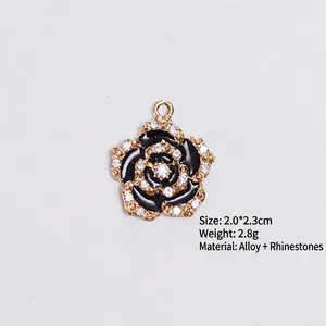 Golden alloy rose pendant with black enamel petals and sparkling rhinestones for DIY jewelry