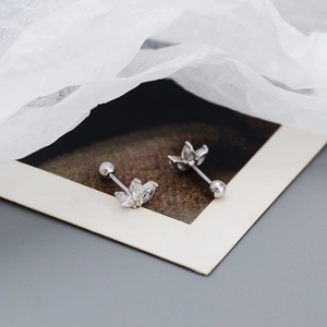 Macro shot of 925 silver flower stud earrings with marquise-cut cubic zirconia and ball back
