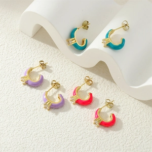 Detail of C-shaped enamel earrings in blue, purple, and pink with zircon stones