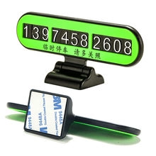 Macro detail of temporary car parking card with neon green panel and 3M adhesive base