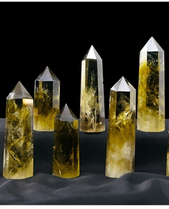 Macro shot of natural Brazilian citrine crystal points on a textured dark background