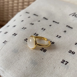 Elegant gold-plated adjustable S925 silver ring featuring a white cat eye stone gemstone