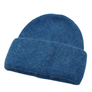 Close-up of navy blue plush knit beanie showing soft wool texture and rolled edge detail