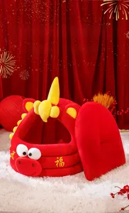 Close-up of the red plush pet bed featuring a golden Fu character and soft cushion