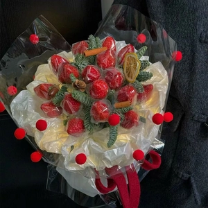 Creative Christmas strawberry bouquet with pine branches and red plush balls wrap