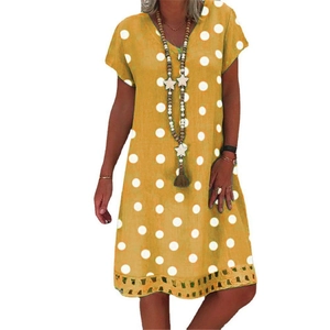 Chic yellow V-neck polka dot midi dress with short sleeves and delicate eyelet lace hem