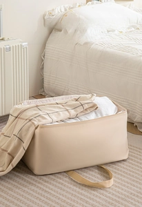 Close-up of beige thickened fabric storage bag with wide handle and large capacity