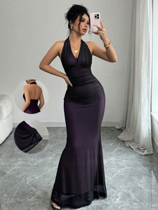 Detail of dark plum satin evening gown with deep V-neckline and sheer mesh hemline