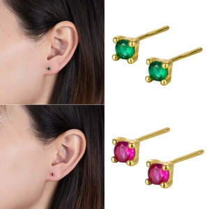 Macro detail of S925 sterling silver stud earrings with 925 hallmarks and zircon inlay