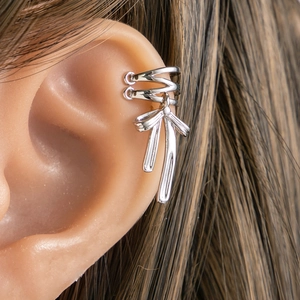 Silver bow pendant ear clip on model showing chic non-pierced earring style