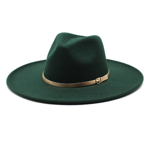 Detail of dark green wool fedora with a fine gold buckle leather decorative band