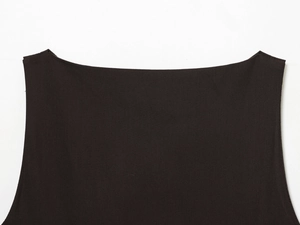 Close-up of a stylish black boat neck dress highlighting the sleek neckline and fabric