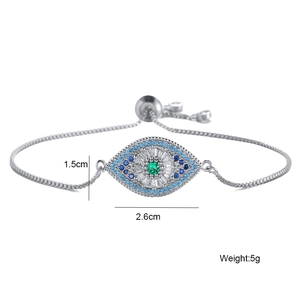 Detailed close-up of adjustable silver box chain bracelet with colorful zircon evil eye pendant