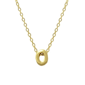 Macro shot of 925 sterling silver golden letter O pendant and fine necklace chain detail