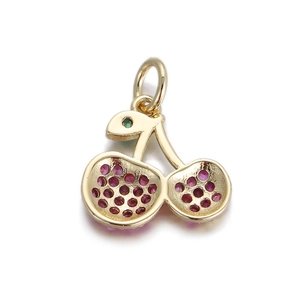 Detailed view of 14k gold cherry pendant with pink gemstones and green leaf inlay