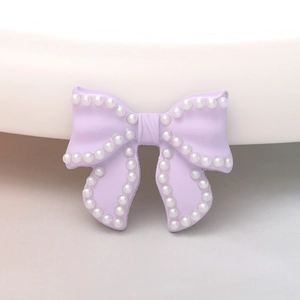 Purple bow charm with white pearl accents for DIY accessories and shoe decoration