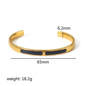 Detail view of gold enamel open bangle showing 6.2mm width and 18.2g weight specifications