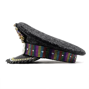 Detailed close-up of colorful rainbow rhinestones and black sequins on party military hat