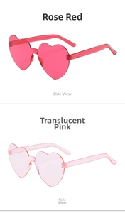 Detail view of heart-shaped rimless sunglasses in rose red and transparent pink colors