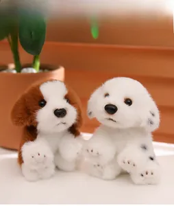 Close-up of plush dalmatian and beagle dog keychains with soft texture and lifelike details