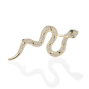Macro shot of gold snake brooch with pavé set crystals and black gemstone eyes