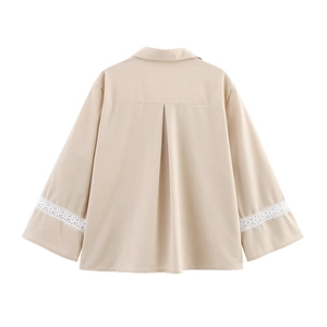 Back view of beige V-neck blouse featuring lace spliced wide sleeves and box pleat detail