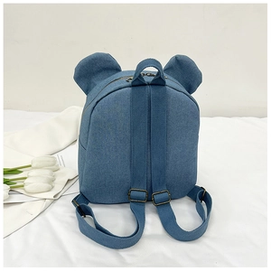 Detail of blue denim toddler backpack with bear ears, dual zippers, and top handle