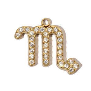 Detailed close-up of Scorpio zodiac pendant with gold plating and cubic zirconia inlay