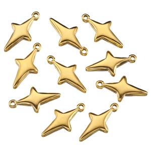 Detailed close-up of ten gold star-shaped stainless steel charms on a white background