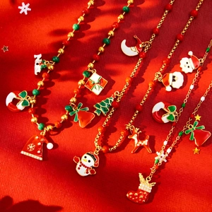 Festive stainless steel Christmas necklace with Santa, tree and reindeer enamel pendants