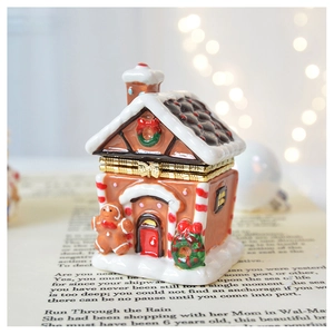 Detail of gingerbread house jewelry box with gold hinge and hand-painted ceramic textures