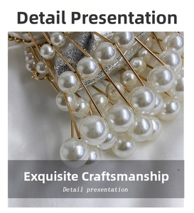 Detail of elegant gold metal lattice hand bag with large white pearls and silver lining
