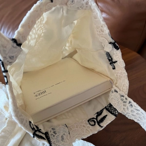 French retro lace tote bag showing interior storage capacity with an inserted book